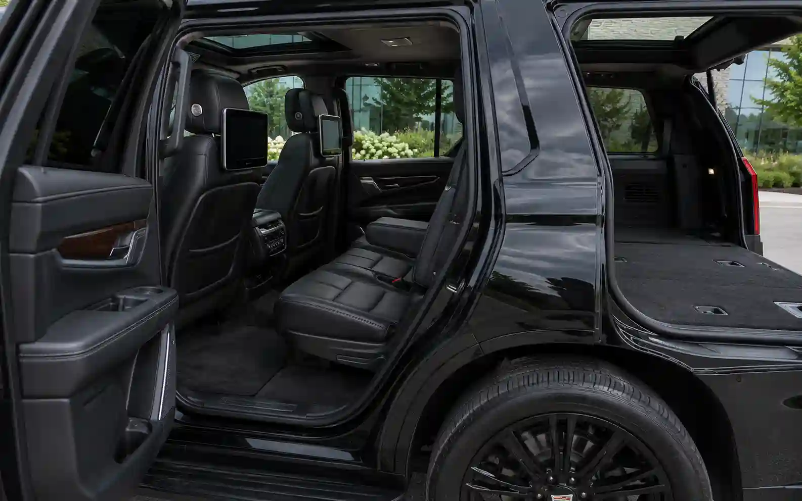 Captain's chairs and third row inside a chauffeured Cadillac Escalade
