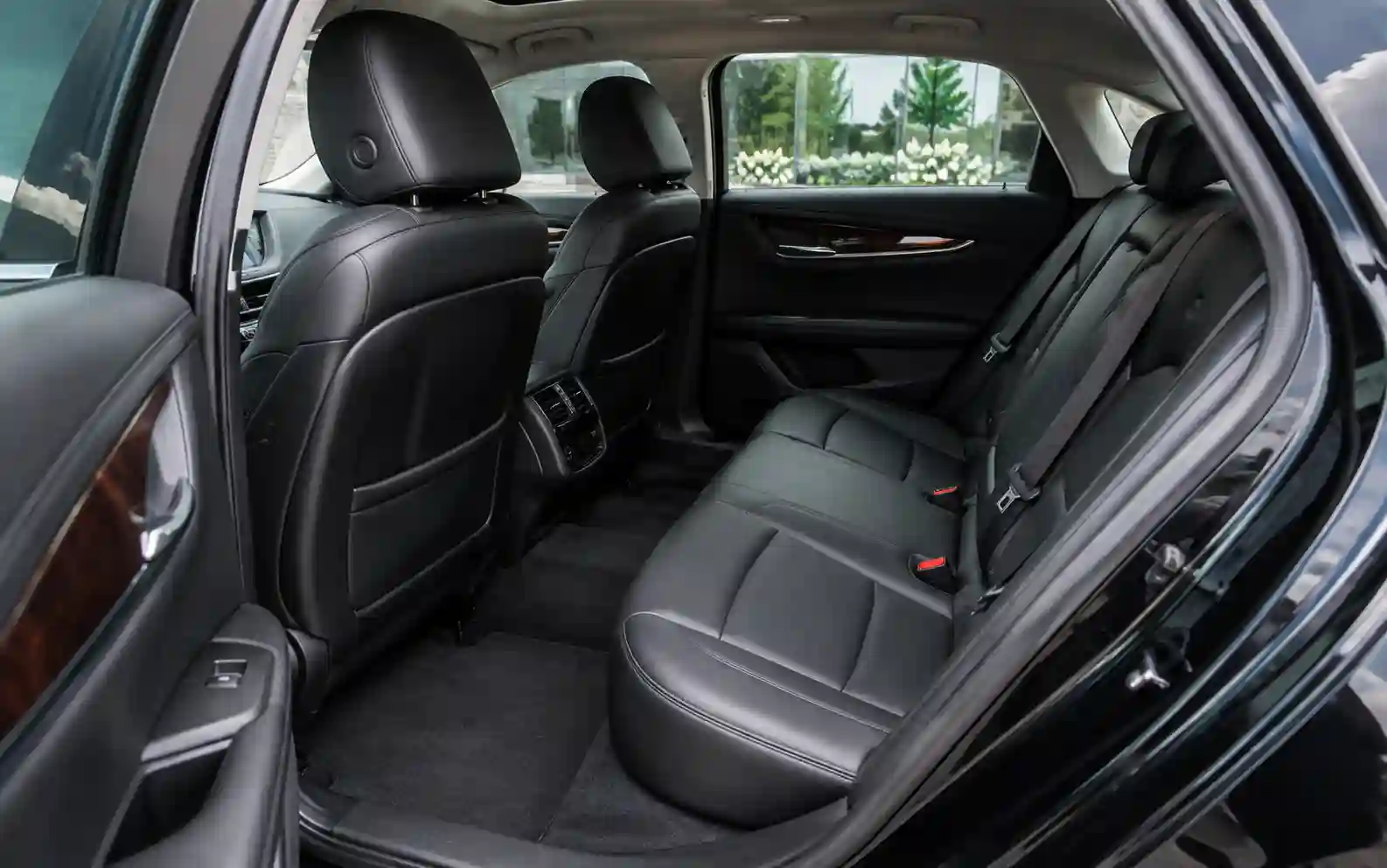 Leather rear seats inside a chauffeured Cadillac XTS sedan