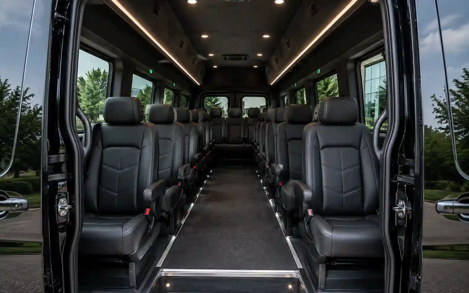 High-roof cabin with executive seats inside a 14-passenger Mercedes Sprinter