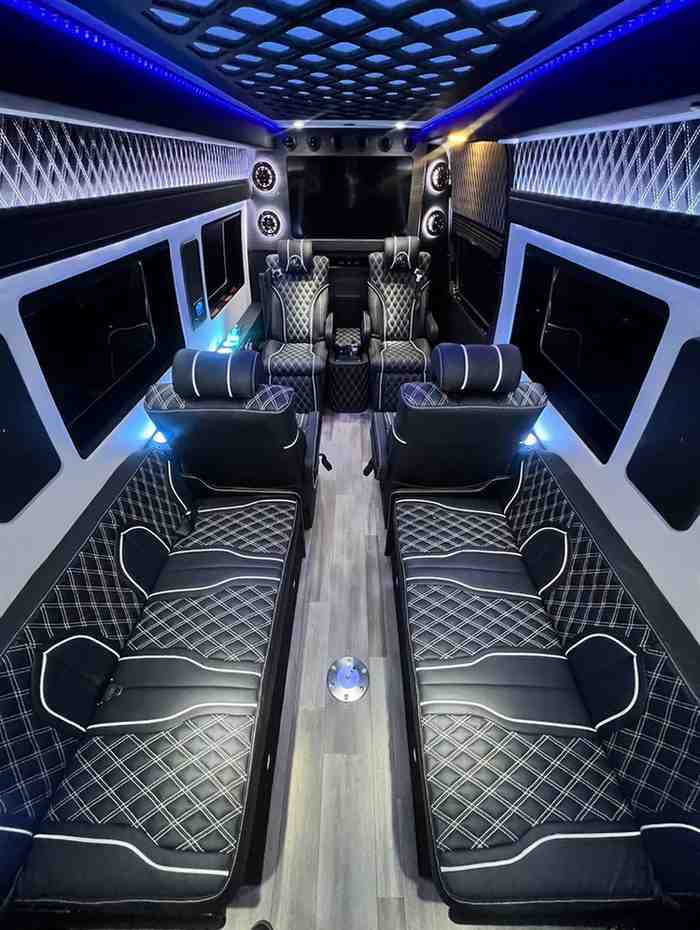 Limo-style sofa seating inside a Mercedes Sprinter party limo